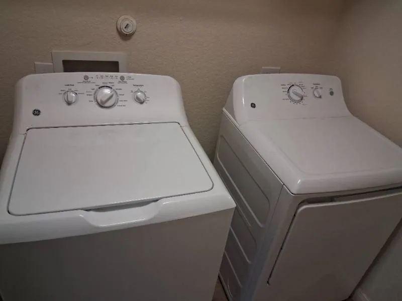Washer and dryer installed side by side for a local customer